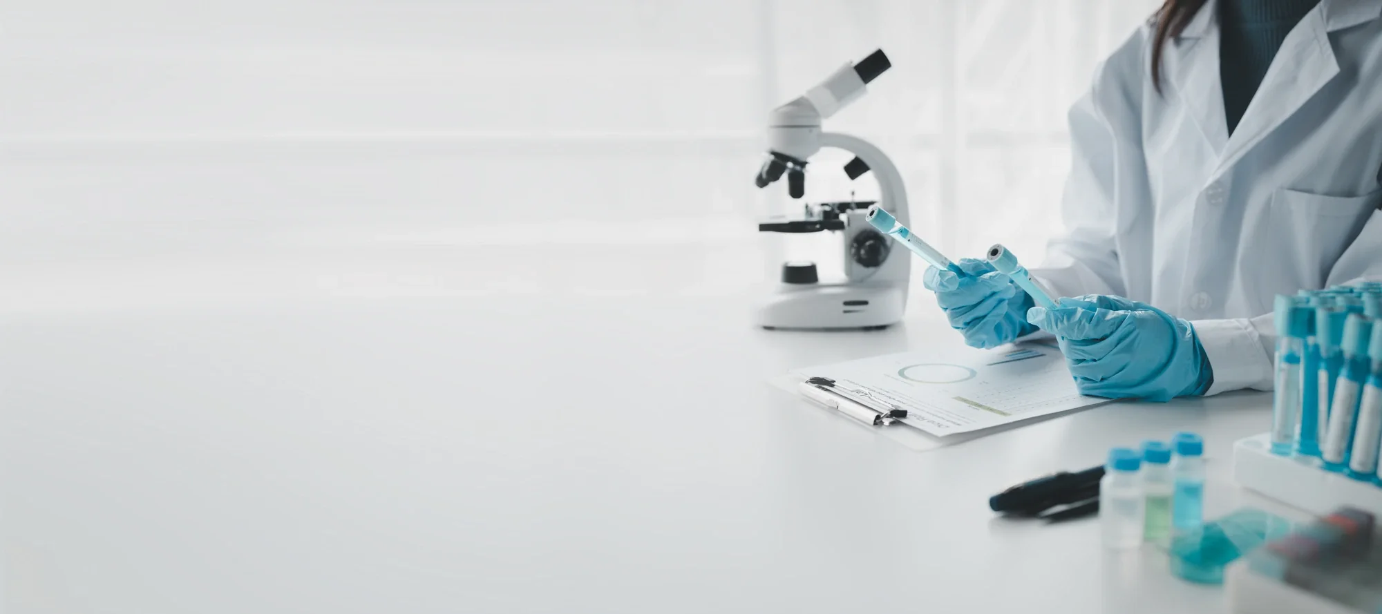 Scientist analysing samples under a microscope