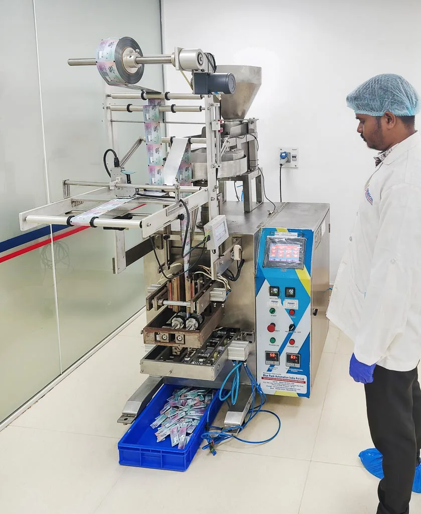 Operator monitoring an automated stick-pack and sachet filling & sealing machine on the Stabicon packaging line