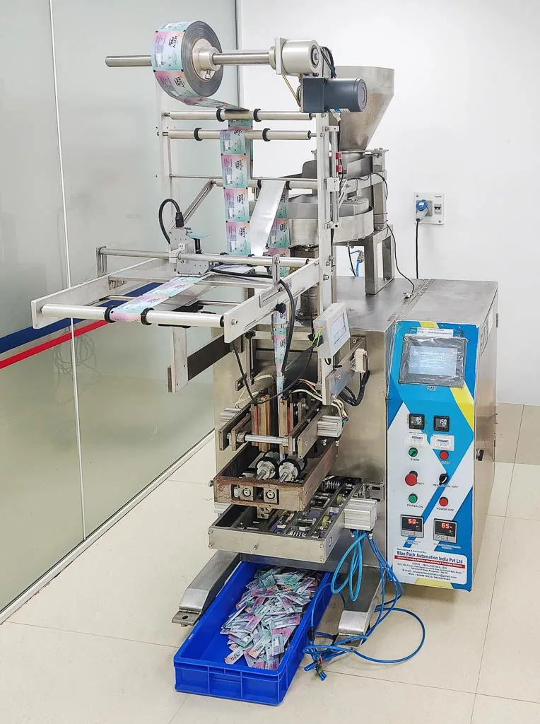 Close-up of the stick-pack filling and sealing machine dispensing finished sachets at Stabicon